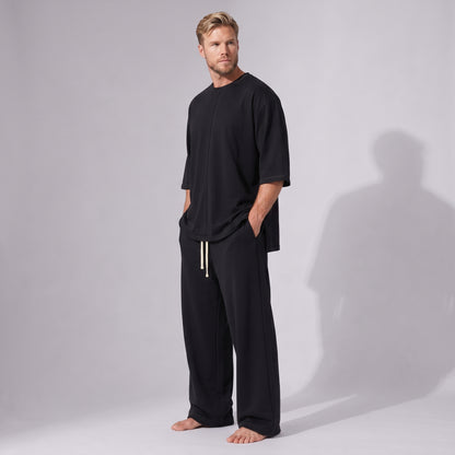 Compleu negru din bumbac cu tricou oversized cu mânecă trei sferturi și pantaloni drepți