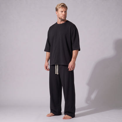 Compleu negru din bumbac cu tricou oversized cu mânecă trei sferturi și pantaloni drepți